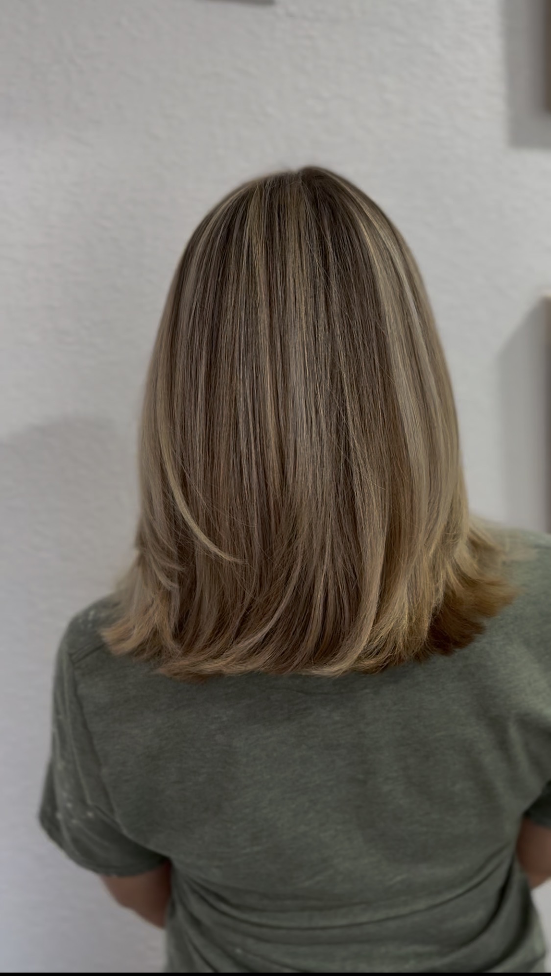 Blonde highlighted bob with soft, layered ends